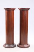 A PAIR OF VICTORIAN MAHOGANY COLUMNAR PEDESTALS