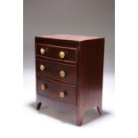 A MINIATURE MAHOGANY CHEST OF DRAWERS IN THE REGENCY TASTE