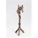 A CARVED OAK "SERPENT" HAT AND COAT STAND