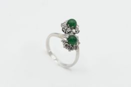 AN EMERALD AND DIAMOND RING