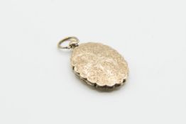 A MID VICTORIAN LOCKET MEMORIAL PENDANT