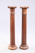 A PAIR OF VICTORIAN MAHOGANY COLUMNS