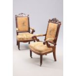 A PAIR OF VICTORIAN MAHOGANY AND UPHOLSTERED LIBRARY CHAIRS