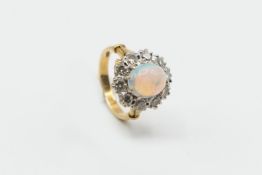 AN OPAL AND DIAMOND CLUSTER RING