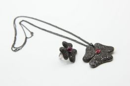 AN ITALIAN BLACK DIAMOND AND RUBY PENDANT AND MATCHING RING BY GAVELLO