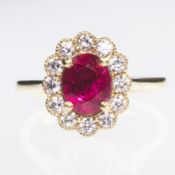 AN 18CT YELLOW GOLD OVAL CUT RUBY AND BRILLIANT CUT DIAMOND CLUSTER RING