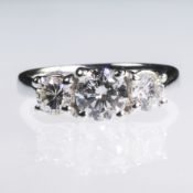 AN 18CT WHITE GOLD AND CERTIFIED THREE STONE DIAMOND RING