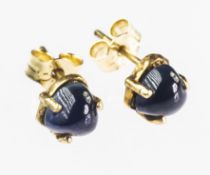 A PAIR OF HEART SHAPED CABOCHON CUT SAPPHIRE EARRINGS