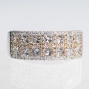 AN 18CT WHITE GOLD AND PRINCESS CUT DIAMOND PAVE SET RING