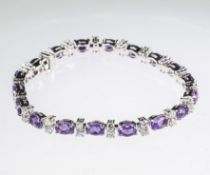 AN 18CT WHITE GOLD, AMETHYST AND DIAMOND BRACELET