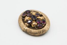 A MID 19TH CENTURY GARNET SET LOCKET BROOCH