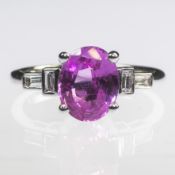 AN 18CT WHITE GOLD OVAL CUT PINK SAPPHIRE AND BAGUETTE CUT DIAMOND RING