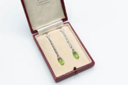 A PAIR OF PERIDOT AND DIAMOND EARRINGS