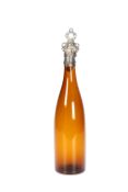 A 19th CENTURY BROWN GLASS BOTTLE DECANTER