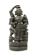 A CARVED WOODEN FIGURE OF A DEITY AND ATTENDANTS