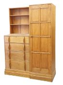 A COTSWOLD SCHOOL OAK COMBINATION WARDROBE