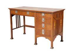 A FINE ARTS AND CRAFTS METAL INLAID OAK DESK