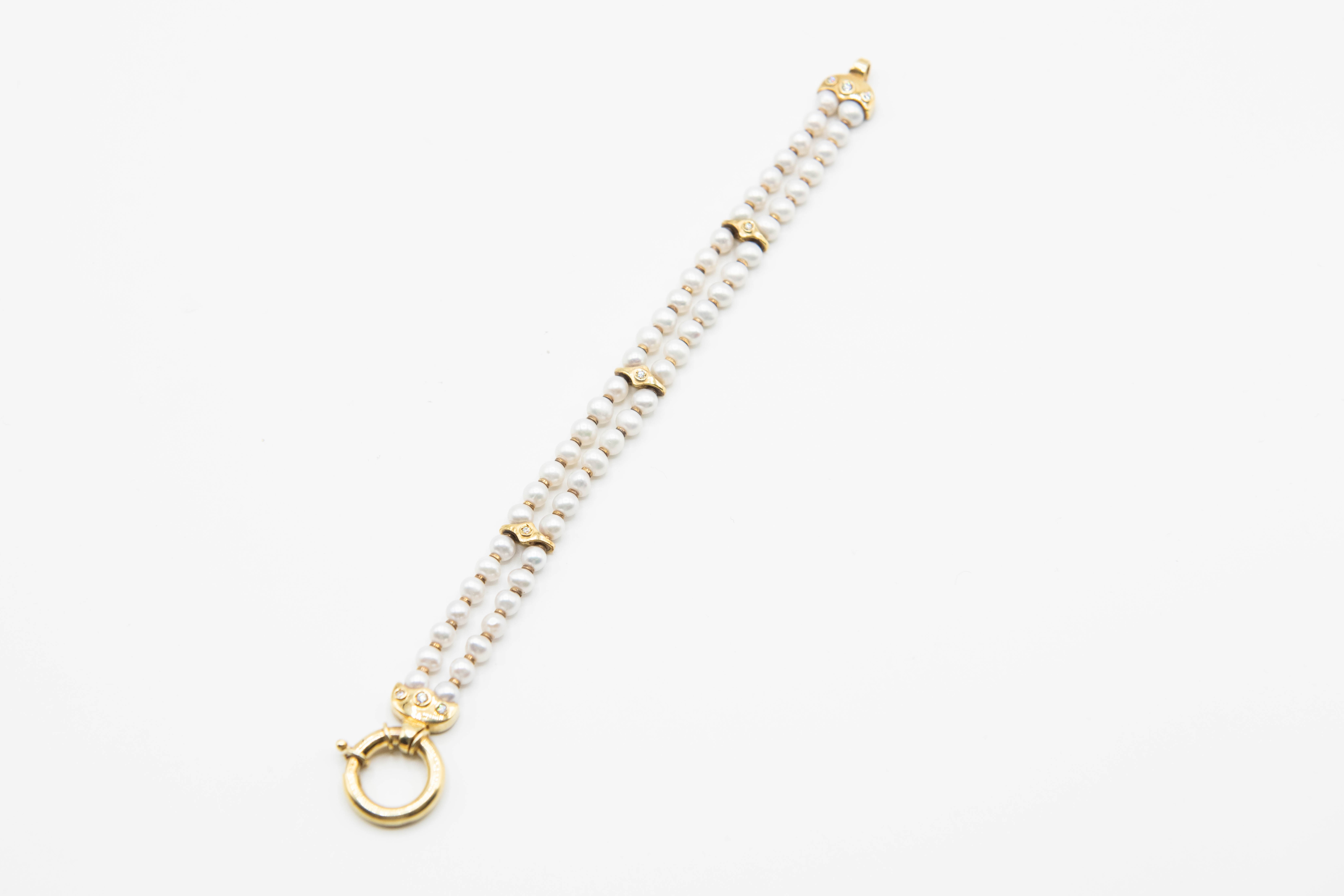 A CONTEMPORARY CULTURED PEARL AND DIAMOND BRACELET