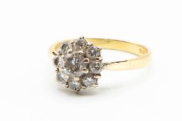 AN 18CT YELLOW GOLD AND DIAMOND RING