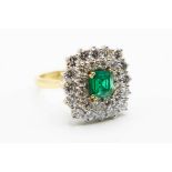 AN 18CT YELLOW GOLD EMERALD AND DIAMOND RING