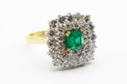 AN 18CT YELLOW GOLD EMERALD AND DIAMOND RING