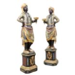 A PAIR OF ITALIAN POLYCHROME CARVED WOODEN TORCHERE FIGURES