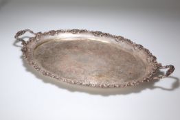 A LARGE LATE VICTORIAN SILVER-PLATED TWO-HANDLED TRAY