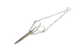 A PAIR OF SCISSORS IN A SILVER CASE AND HANGER OF CHATELAINE TYPE