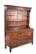 A GEORGE III OAK DRESSER AND RACK