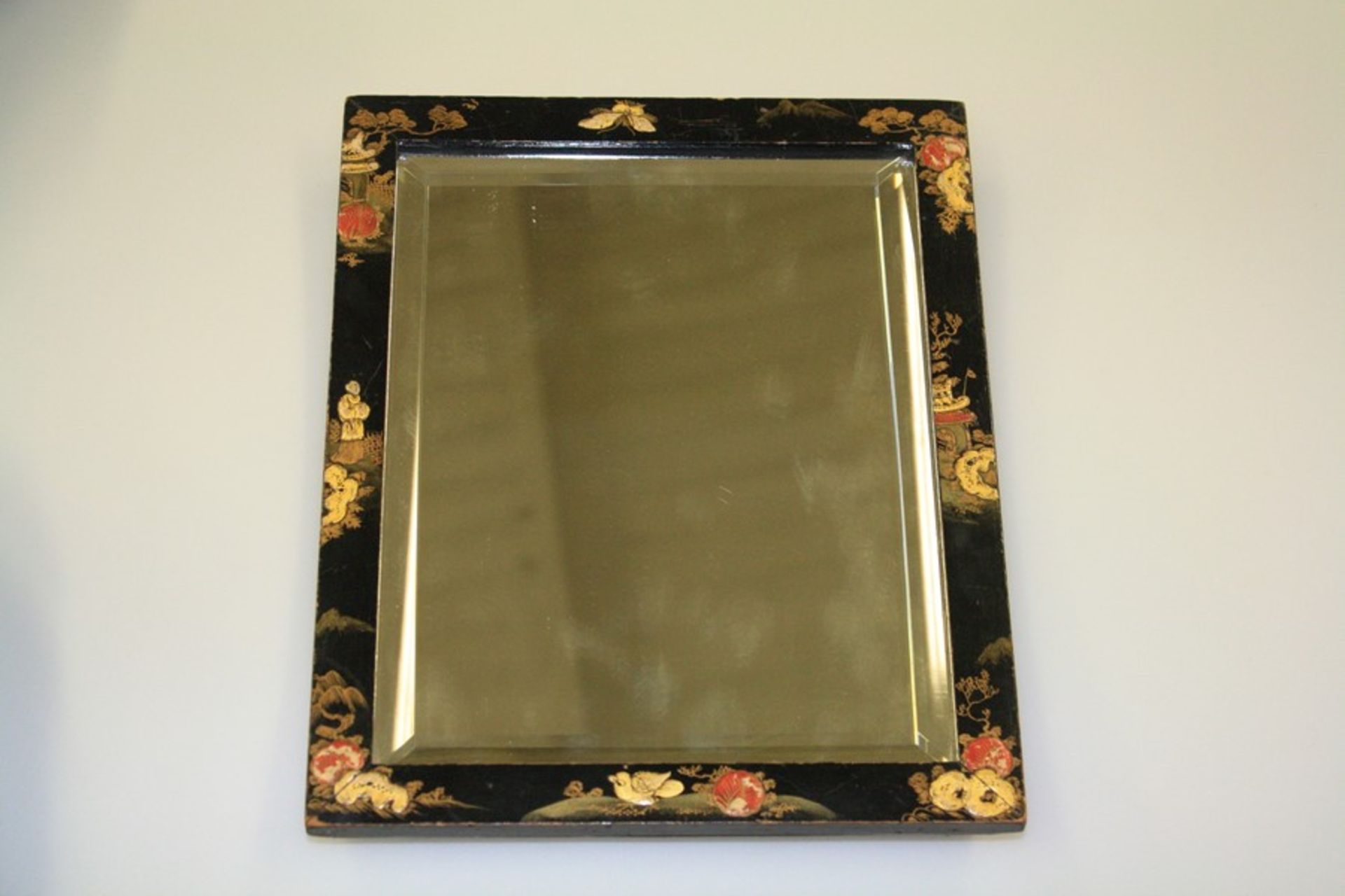A 1920'S CHINOISERIE LACQUER MIRROR