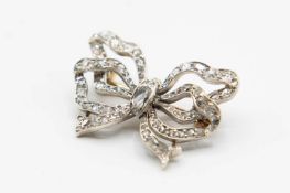 AN EARLY VICTORIAN DIAMOND SET BOW BROOCH