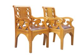 A PAIR OF GOLDEN OAK ARMCHAIRS, POSSIBLY BY ARTHUR ROMNEY GREEN