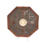 A LATE 19TH CENTURY IVORY AND COPPER PLAQUE OF THE JERUSALEM PILGRIM'S CROSS