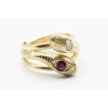 A DIAMOND AND RUBY SET SNAKE RING