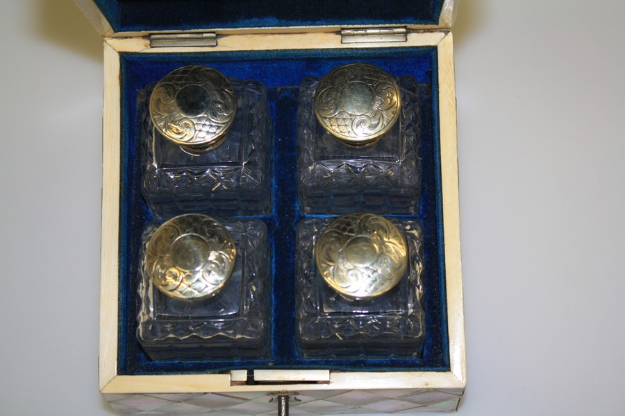 A SET OF FOUR SILVER-PLATED SCENT BOTTLES, IN A MOTHER-OF-PEARL CASKET - Image 4 of 9