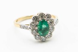 AN 18CT YELLOW GOLD EMERALD AND DIAMOND RING