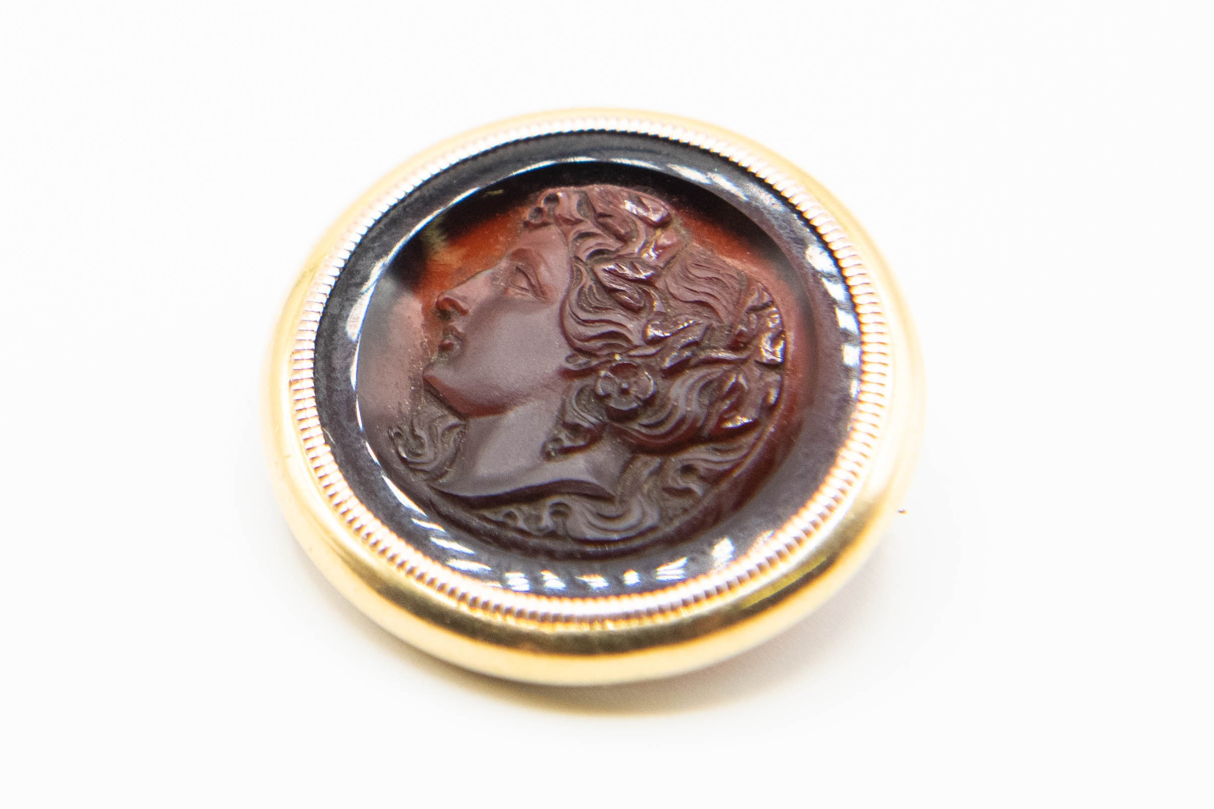 A CARVED CARNELIAN INTAGLIO