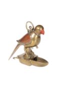 AN ENAMELLED BRASS PARROT-FORM BIRD FEEDER, LATE 19th CENTURY