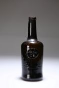 A "COMMON ROOM" OLIVE GREEN GLASS SEALED WINE BOTTLE