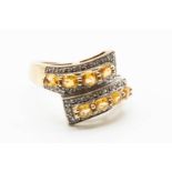 A 9CT YELLOW GOLD AND CITRINE RING