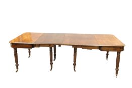 A REGENCY MAHOGANY TELESCOPIC ACTION DINING TABLE, IN THE MANNER OF GILLOWS