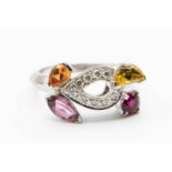 AN 18CT WHITE GOLD AND MULTI GEM SET RING BY CARTIER