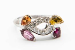 AN 18CT WHITE GOLD AND MULTI GEM SET RING BY CARTIER