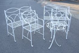 A SUITE OF REGENCY STYLE WHITE PAINTED WROUGHT IRON GARDEN FURNITURE