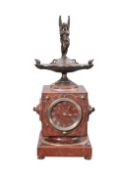 A FRENCH BRONZE AND ROUGE MARBLE MANTEL CLOCK