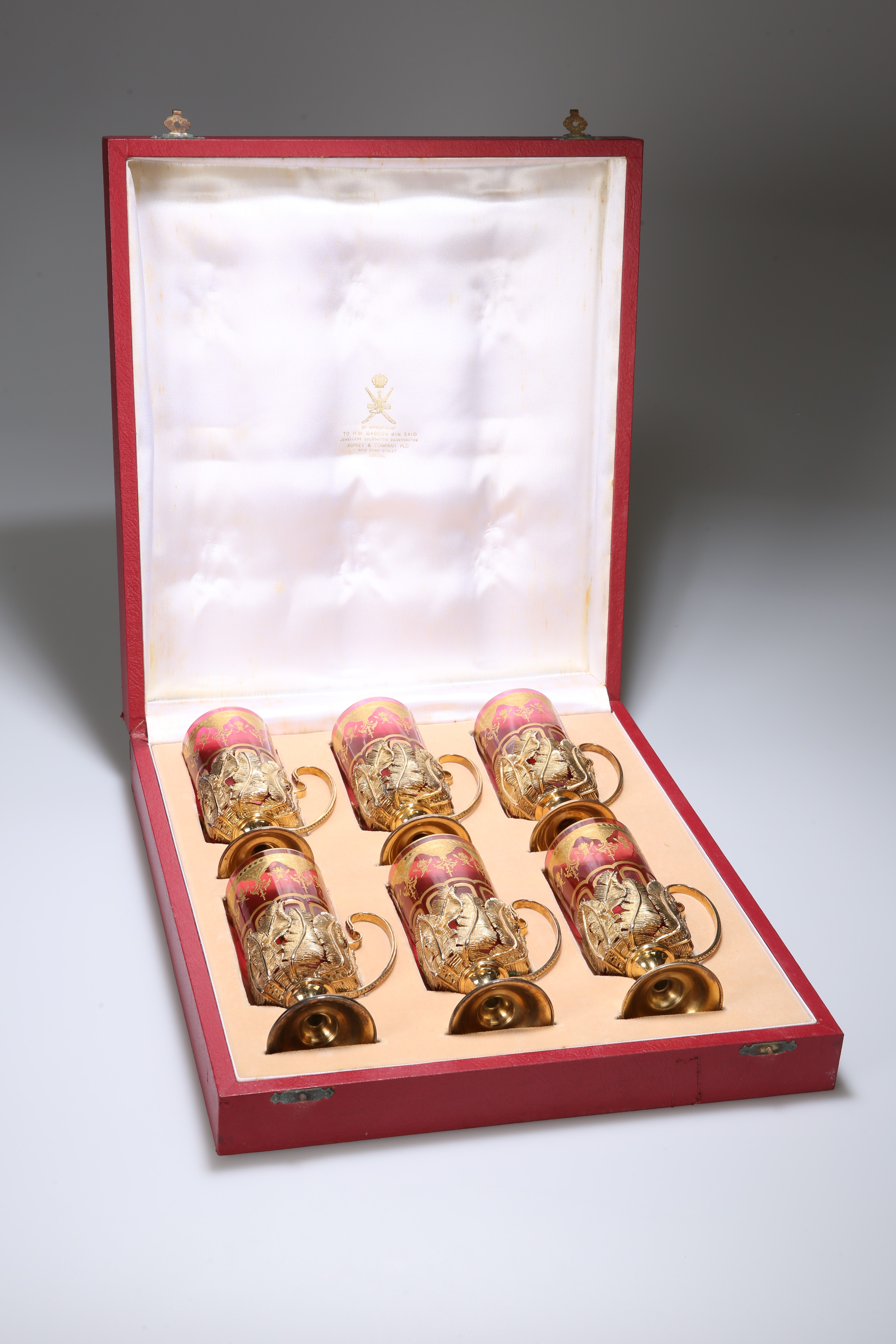 A FINE SET OF SIX SILVER-GILT AND BACCARAT TEA GLASSES