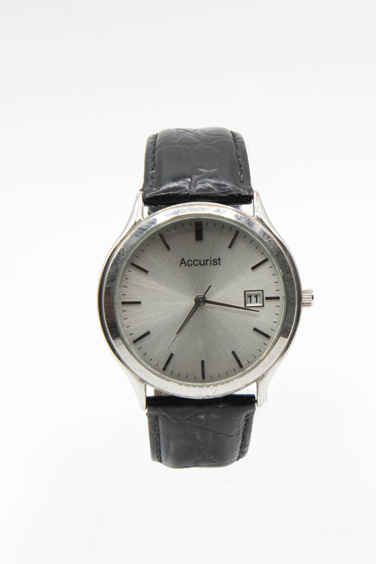 AN ACCURIST STAINLESS STEEL WRIST WATCH