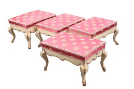 A SET OF FOUR CONTINENTAL PAINTED STOOLS