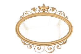 AN ADAM REVIVAL GILT-COMPOSITION MIRROR