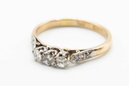 AN 18CT YELLOW GOLD PLATINUM AND DIAMOND SET RING